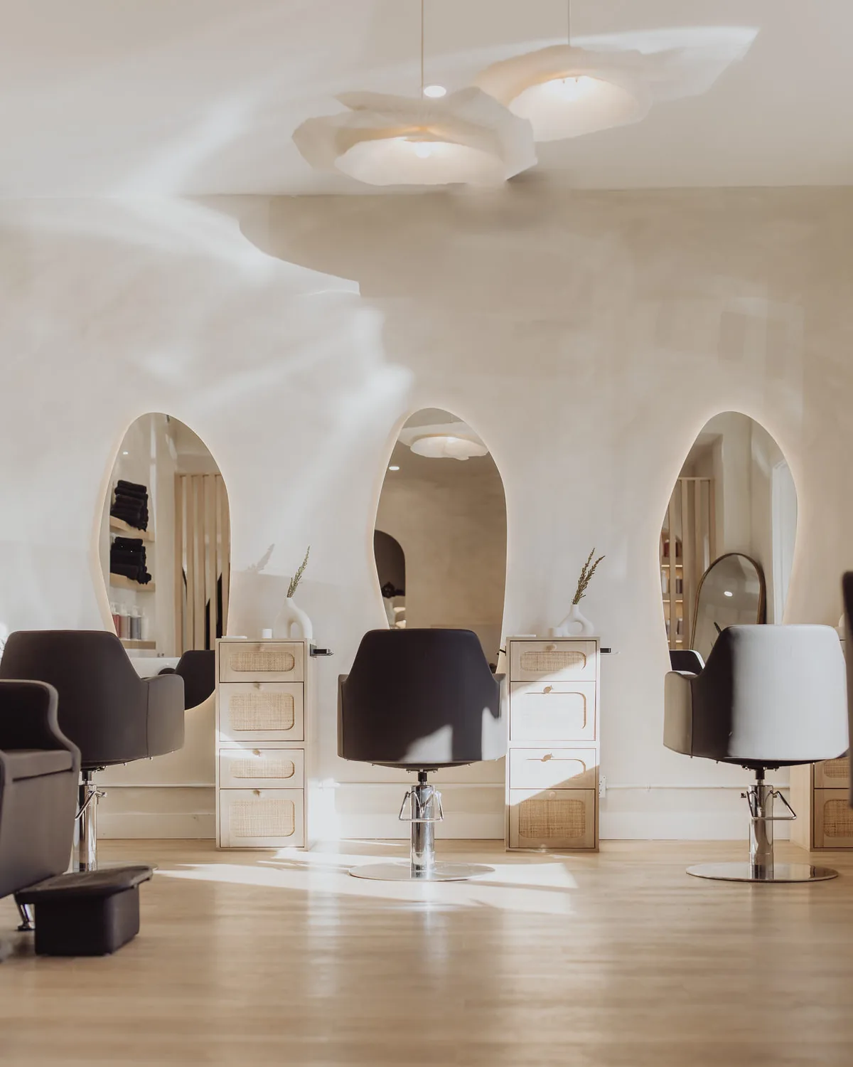Arched mirrors and styling chairs at Blonde Culture Cochrane