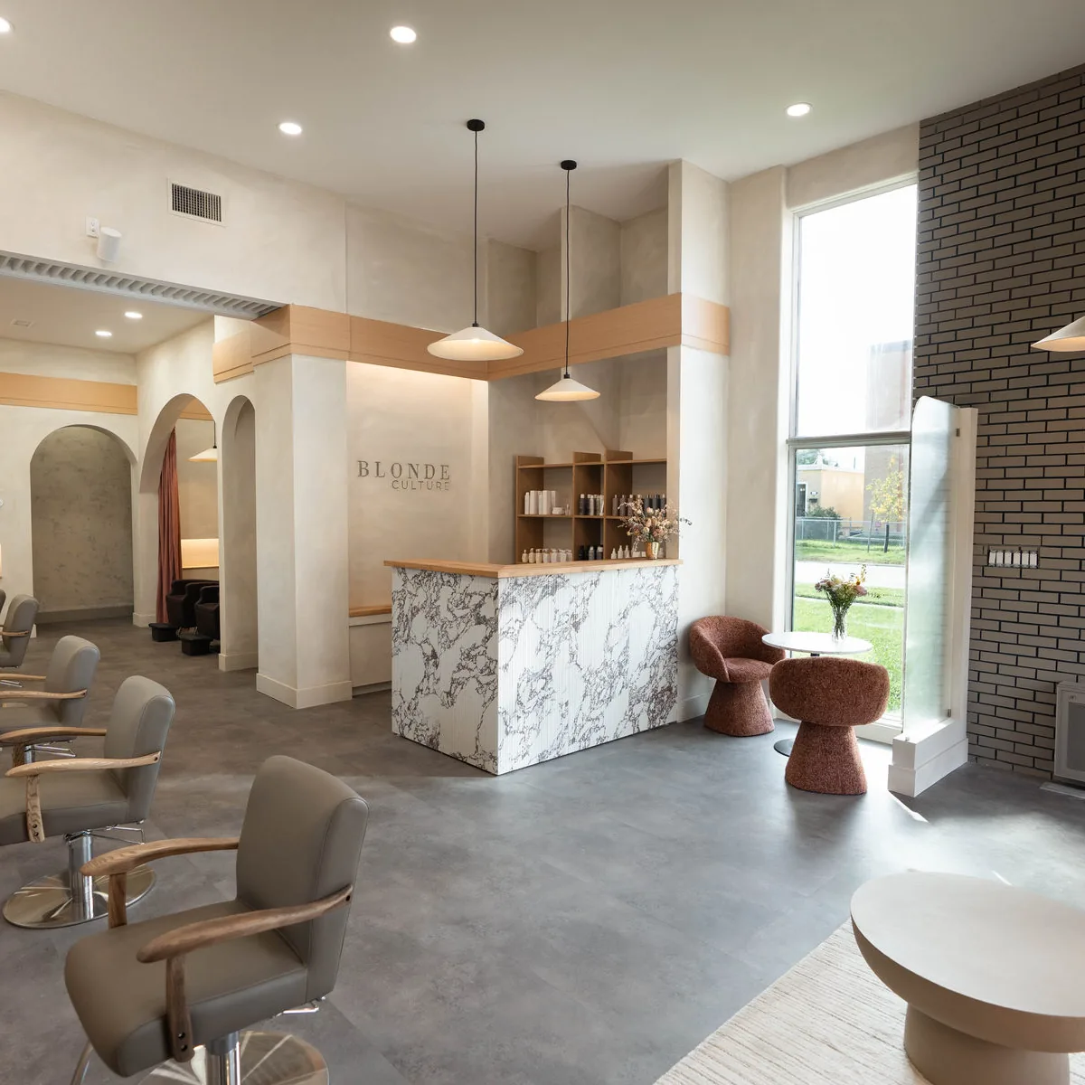 Styling floor and marble front desk at Blonde Culture Winnipeg