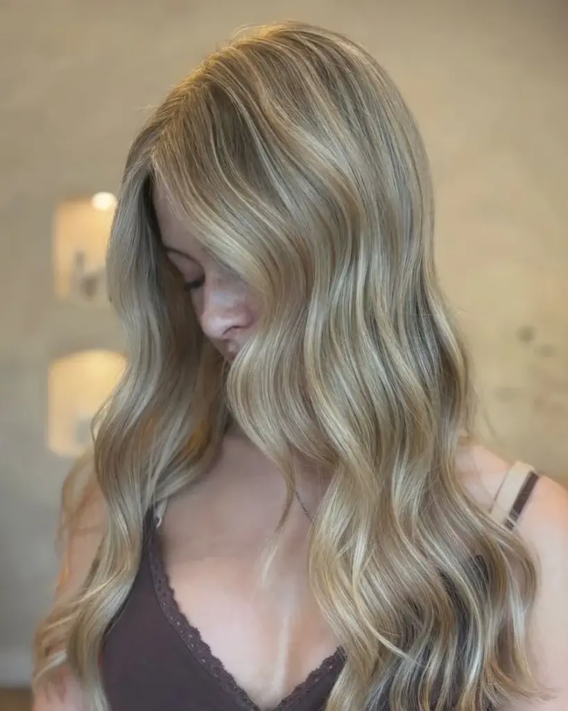 Bright blonde with a soft root, by Carly