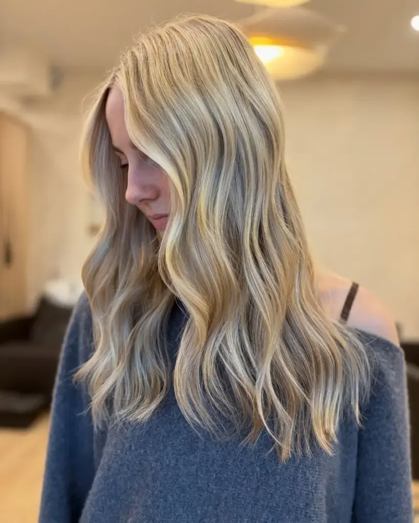 Glossy blonde with face-framing brightness, by Carly